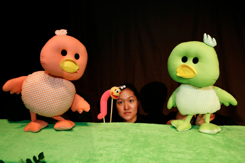 The two duckies and the little worm puppet in Duckie Can't Swim by Paper Monkey Theatre