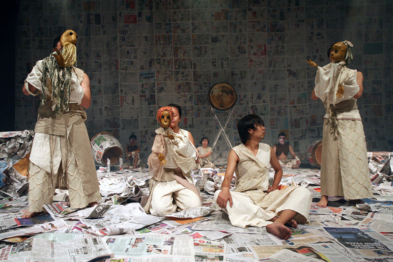 Hero looking at three puppets in Death of A Hero by Paper Monkey Theatre Singapore