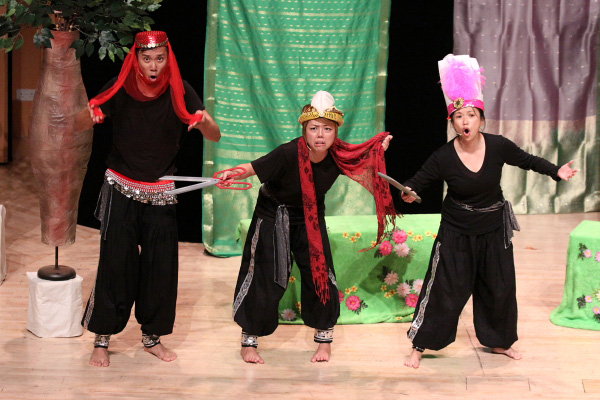 Three actors on stage as cook, soldier and concubine