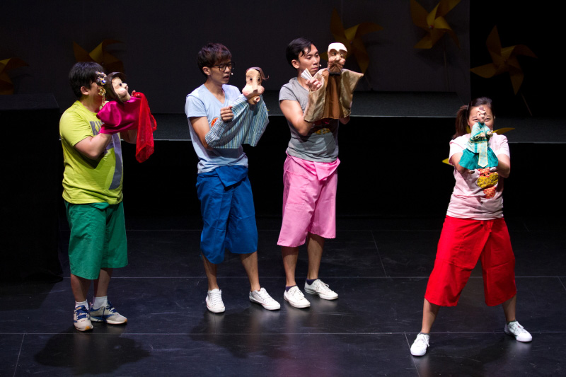 Actors holding hand puppets in The Three Big Bullies by Paper Monkey Theatre Singapore