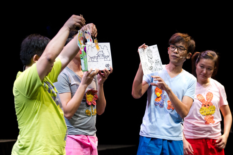 Actors holding up art and craft puppet samples in The Three Big Bullies by Paper Monkey Theatre Singapore