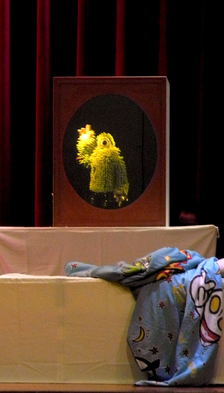 Green Puppet Monster in mirror in Monster Under My Bed Community Tour