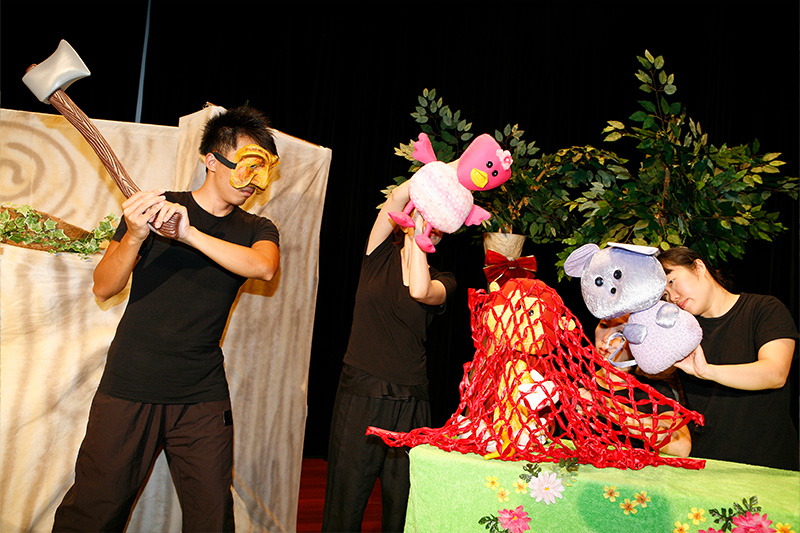 Monkey caught in a net with a man with ax and other animals in Paper Monkey Theatre School Show Tree Neighbours