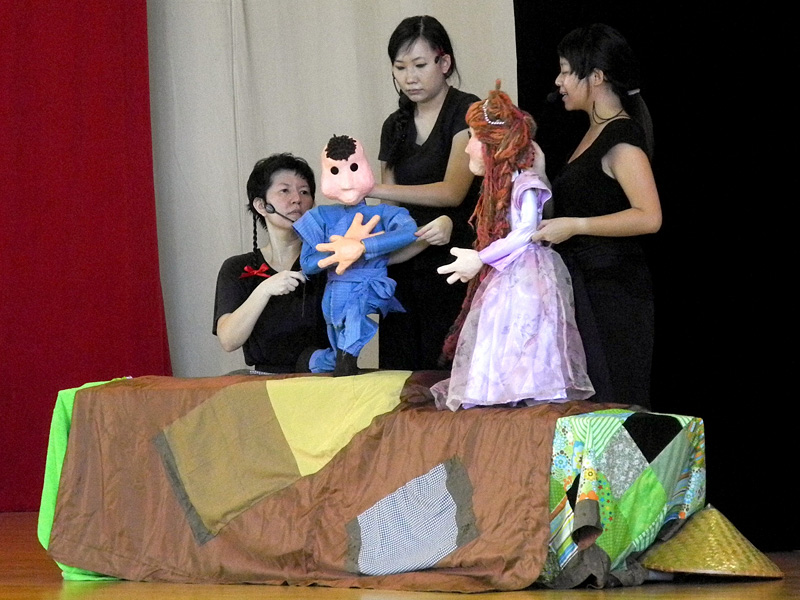 Princess life size puppet with boy puppet talking in Dragon Dance Community Tour by Paper Monkey