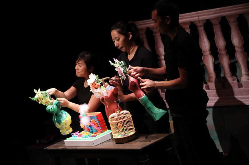 Three actors manipulating the colourful nonya puppets in The Nonya Nightingale by Paper Monkey Theatre Singapore