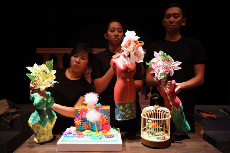 Three colourful nonya puppets with flowers in The Nonya Nightingale by Paper Monkey Theatre Singapore