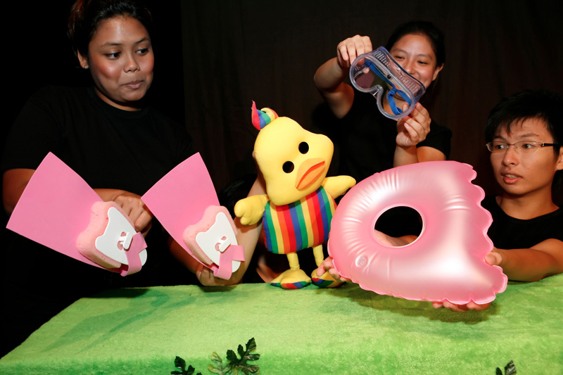 Duckie with float and flippers in Duckie Can't Swim by Paper Monkey Theatre