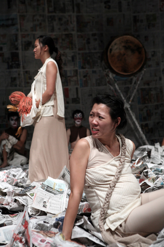 A pregnant lady looking back to another lady in Death of A Hero by Paper Monkey Theatre Singapore