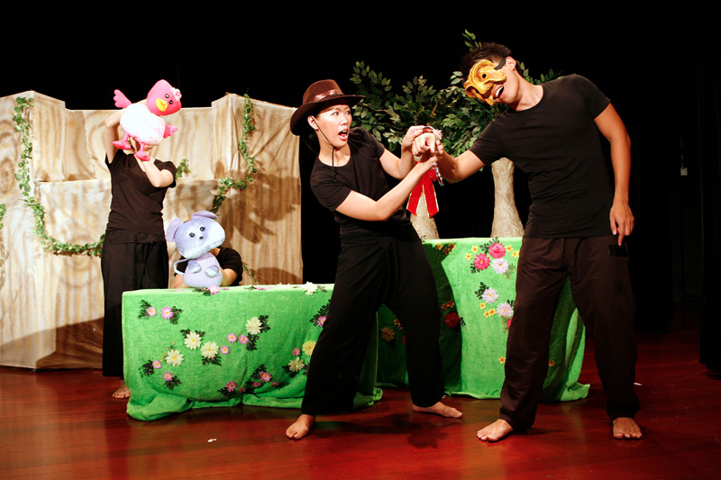 Duck and mouse puppets and two actors on stage in Tree Neighbours by Paper Monkey Theatre Singapore