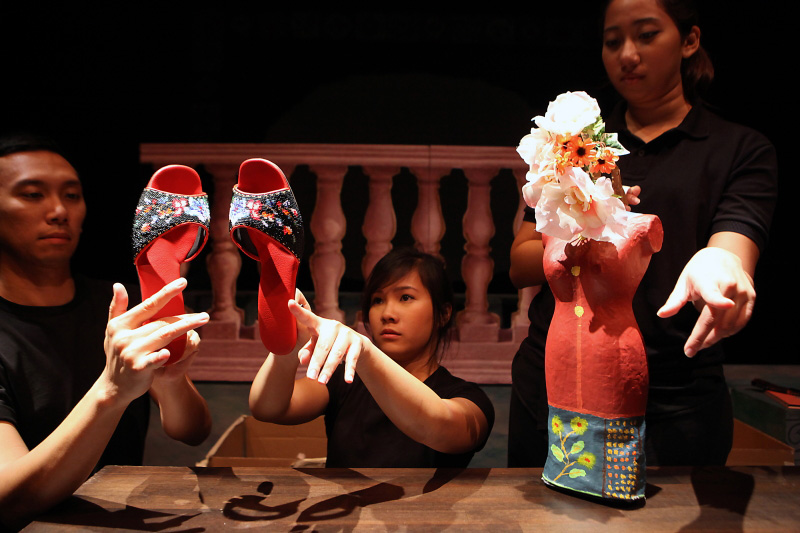 A pair of traditional Nonya beaded shoes and a Nonya puppet in The Nonya Nightingale by Paper Monkey Theatre Singapore