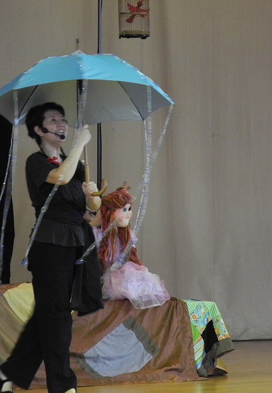 Princess puppet and umbrella prop in Dragon Dance Community Tour by Paper Monkey