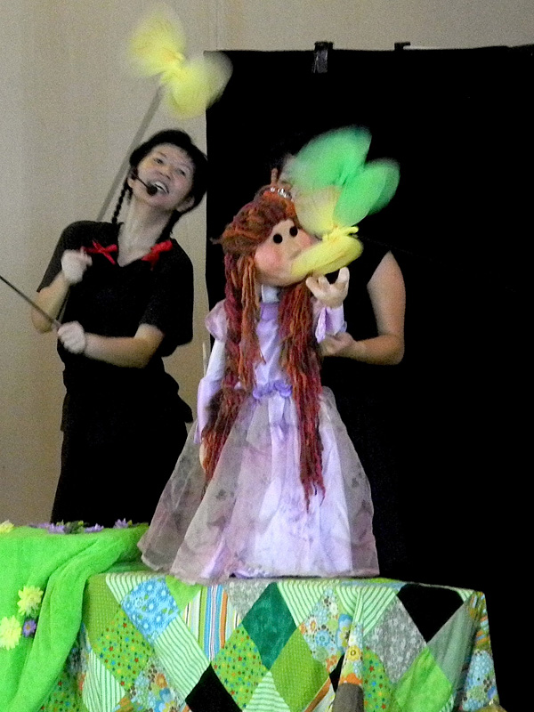 Princess puppet dancing with butterfly puppet in Dragon Dance Community Tour by Paper Monkey