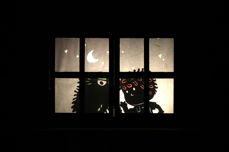 Shadow puppets of Joey and monster in Monster Under My Bed by Paper Monkey