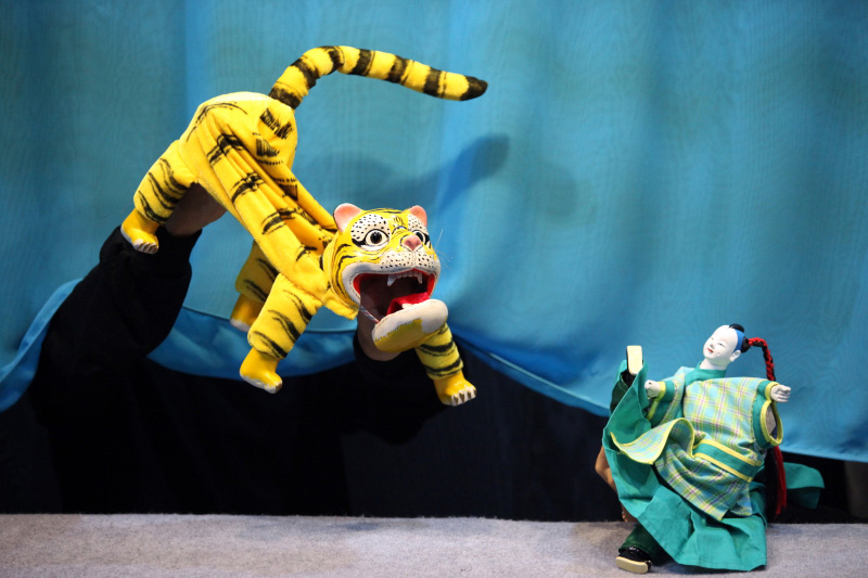 Traditional hand puppets of tiger and Zhou Chu At Treehouse The Three Big Bullies by Paper Monkey Theatre